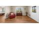 This sitting room is conveniently located near the Primary bedroom and features hardwood floors and a door to the back patio at 722 Laurel Canyon Pkwy, Canton, GA 30114