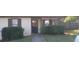 Charming home with front yard, sidewalk to door, and privacy hedge at 8219 Canyon Forge Dr, Riverdale, GA 30274