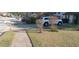 Residential street view with lush green lawn, driveway, and mailbox at 8219 Canyon Forge Dr, Riverdale, GA 30274