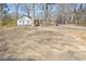 Expansive backyard with mature trees and a detached structure, offering plenty of outdoor space at 119 Old Vandiver Dr, Canton, GA 30114