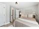 Bedroom featuring an accent rug, calming decor, and a view into the adjacent dining area at 119 Old Vandiver Dr, Canton, GA 30114