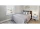 Neutral bedroom featuring a cushioned headboard, comfy bedding and an accent rug at 119 Old Vandiver Dr, Canton, GA 30114