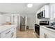 Kitchen with stainless steel refrigerator, white cabinets, and stainless steel appliances at 119 Old Vandiver Dr, Canton, GA 30114