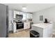 Modern kitchen featuring white cabinets, stainless steel appliances, and a sleek countertop at 119 Old Vandiver Dr, Canton, GA 30114