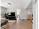 Bright and airy living room featuring hardwood floors, neutral decor, and modern furnishings at 119 Old Vandiver Dr, Canton, GA 30114