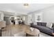 Open-concept living space with hardwood floors, combining the living room, dining area, and kitchen at 119 Old Vandiver Dr, Canton, GA 30114