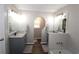 Bathroom with dual vanities, granite countertop, modern fixtures, and a tub at 2562 Kennesaw Springs Nw Ct, Kennesaw, GA 30144