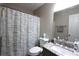 Bathroom with a sink and vanity with granite countertop and a shower with a curtain at 2562 Kennesaw Springs Nw Ct, Kennesaw, GA 30144