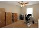 Bedroom featuring a ceiling fan, a window with natural light, and a desk at 2562 Kennesaw Springs Nw Ct, Kennesaw, GA 30144