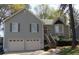 Charming two-story home with a well-maintained lawn, two car garage and inviting entryway at 2562 Kennesaw Springs Nw Ct, Kennesaw, GA 30144