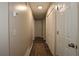 Inviting hallway features wood floors, closet, and neutral paint for a bright and welcoming space at 2562 Kennesaw Springs Nw Ct, Kennesaw, GA 30144