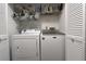 Closet-style laundry area featuring a white washer and dryer at 2562 Kennesaw Springs Nw Ct, Kennesaw, GA 30144