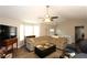 Spacious living room with vaulted ceilings, large windows, ceiling fan and comfortable seating at 2562 Kennesaw Springs Nw Ct, Kennesaw, GA 30144