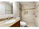 Bathroom features a tiled shower with a built-in niche, granite countertops, and modern fixtures at 2970 Aspen Woods Entry, Atlanta, GA 30360