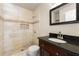 Renovated bathroom with granite countertop vanity, a new sink, a tiled shower, and modern fixtures at 2970 Aspen Woods Entry, Atlanta, GA 30360
