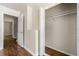 Walk-in closet with wood floors, ample shelf space, and access to the main bedroom at 2970 Aspen Woods Entry, Atlanta, GA 30360
