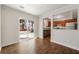 Bright dining room featuring wood flooring, a sliding glass door to backyard, and view into the kitchen at 2970 Aspen Woods Entry, Atlanta, GA 30360