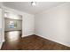 Open-concept living room featuring hardwood floors, fresh white paint, and natural light through new windows at 2970 Aspen Woods Entry, Atlanta, GA 30360