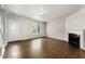 Comfortable living room featuring white trim, fireplace and wood-look tile at 2970 Aspen Woods Entry, Atlanta, GA 30360