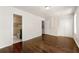 Main bedroom showcasing hardwood floors, fresh paint, and access to both the main bath and closet at 2970 Aspen Woods Entry, Atlanta, GA 30360