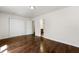 Spacious main bedroom featuring a large closet, hardwood floors, and fresh neutral paint at 2970 Aspen Woods Entry, Atlanta, GA 30360