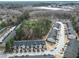 Extensive aerial view of townhomes with a focus on community layout and surrounding greenery and buildings at 3132 Meadowstone Sw Ln, Atlanta, GA 30331