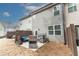 View of the backyard featuring a patio set, a grill, and privacy fence at 3132 Meadowstone Sw Ln, Atlanta, GA 30331