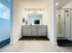 Bright bathroom with double vanity, walk-in shower and stylish fixtures for a luxurious feel at 3132 Meadowstone Sw Ln, Atlanta, GA 30331