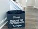 Entryway features a cute storage bin, wood-look floors, and white stairs leading to the upper level at 3132 Meadowstone Sw Ln, Atlanta, GA 30331