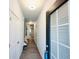 Inviting hallway with wood-look floors, featuring white doors and a view into adjacent rooms at 3132 Meadowstone Sw Ln, Atlanta, GA 30331