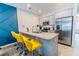 Kitchen featuring granite countertops, stainless steel appliances, and a breakfast bar with yellow stools at 3132 Meadowstone Sw Ln, Atlanta, GA 30331