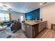 Open concept living space showing living, dining, and kitchen areas with modern furnishings and decor at 3132 Meadowstone Sw Ln, Atlanta, GA 30331