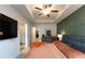 Bright main bedroom showcases modern decor, ceiling fan and ample natural light, creating a cozy retreat at 3132 Meadowstone Sw Ln, Atlanta, GA 30331