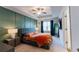 Bright main bedroom features decorative wall trim, ceiling fan and neutral color palette at 3132 Meadowstone Sw Ln, Atlanta, GA 30331