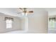 Large bedroom with a ceiling fan, window seat and access to multiple rooms at 5162 Charlemagne Sw Way, Lilburn, GA 30047