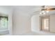 Bedroom with window seat, ceiling fan, and access to hallway at 5162 Charlemagne Sw Way, Lilburn, GA 30047