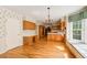 Spacious kitchen and eat-in area featuring hardwood floors and window seat at 5162 Charlemagne Sw Way, Lilburn, GA 30047