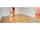 Open living room with gleaming hardwood floors, fresh white walls, and ample natural light at 5162 Charlemagne Sw Way, Lilburn, GA 30047