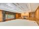Spacious living room with custom wood built-ins, a fireplace, and large windows at 5162 Charlemagne Sw Way, Lilburn, GA 30047