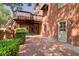 Brick patio with brick pillar posts and exterior light, offering a stylish outdoor space at 5162 Charlemagne Sw Way, Lilburn, GA 30047