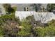 Aerial view of the property, featuring a building surrounded by mature trees and lush greenery at 89 De Arc Nw Pl, Atlanta, GA 30327