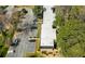 Birds-eye view of multi-unit complex featuring ample parking and surrounded by mature trees and landscaping at 89 De Arc Nw Pl, Atlanta, GA 30327