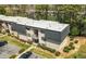 Multi-story apartment building featuring well-maintained landscaping, parking, and access stairs at 89 De Arc Nw Pl, Atlanta, GA 30327