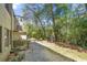 View of the property featuring lush greenery, mature trees, and the building's exterior at 89 De Arc Nw Pl, Atlanta, GA 30327