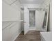 Walk-in closet with wire shelving, mirror, bench, and view into the bathroom at 89 De Arc Nw Pl, Atlanta, GA 30327