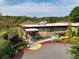 Inviting clubhouse with stone accents, ramp access, and landscaping offers dining at the Cross Creek Cafe at 89 De Arc Nw Pl, Atlanta, GA 30327
