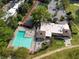 Aerial view showcasing pool, tennis court, and clubhouse amenities for active community living at 89 De Arc Nw Pl, Atlanta, GA 30327