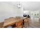 Open-concept dining room featuring modern light fixture and wood table set at 89 De Arc Nw Pl, Atlanta, GA 30327