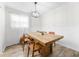 Comfortable dining area featuring wainscoting and a decorative light fixture at 89 De Arc Nw Pl, Atlanta, GA 30327