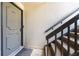 A welcoming entryway featuring stairs and a door marked with the number 89 at 89 De Arc Nw Pl, Atlanta, GA 30327